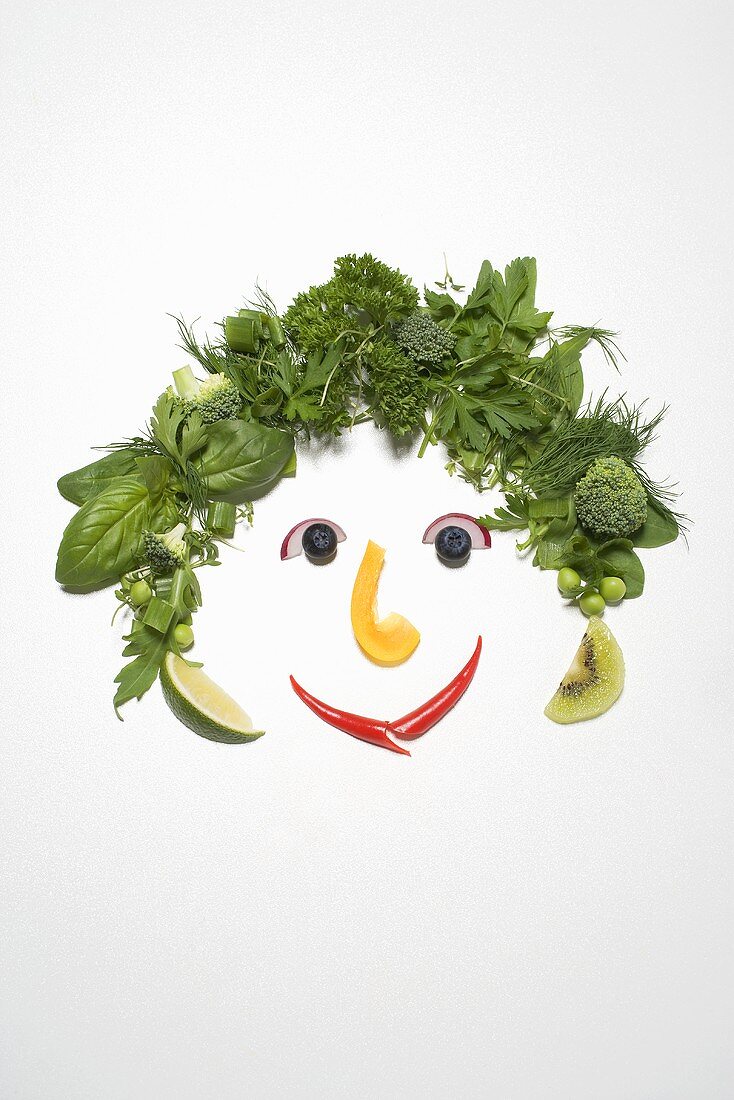 Gesicht aus Kräutern und Gemüse