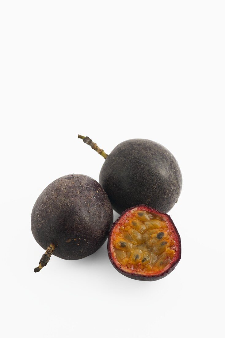 Two whole passion fruits and one half