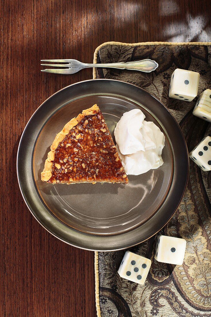 Piece of quince tart with cream (overhead view)