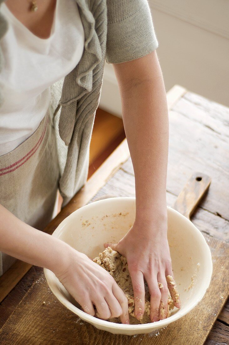 Woman kneading dough