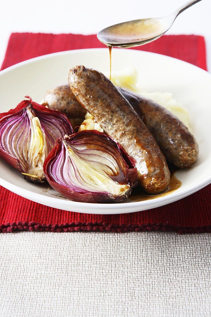 Sausages and mash with onions and gravy