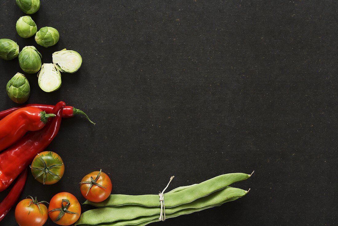 Still life with Brussels sprouts, chillies, tomatoes and beans