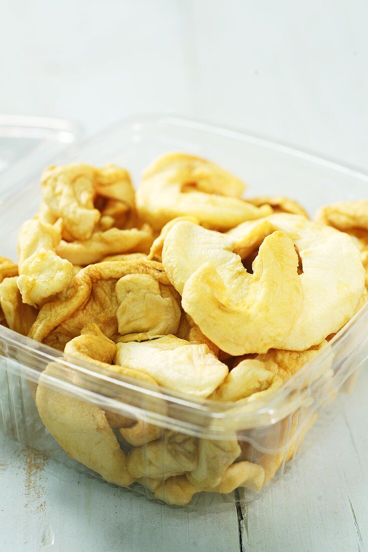 Dried apple rings in plastic container
