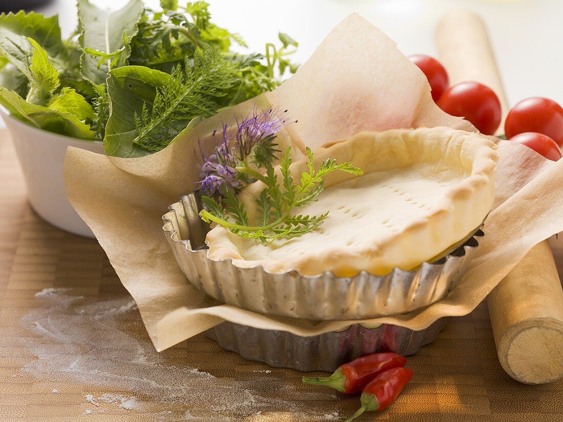 Ingredients for tarts: pastry cases and herbs