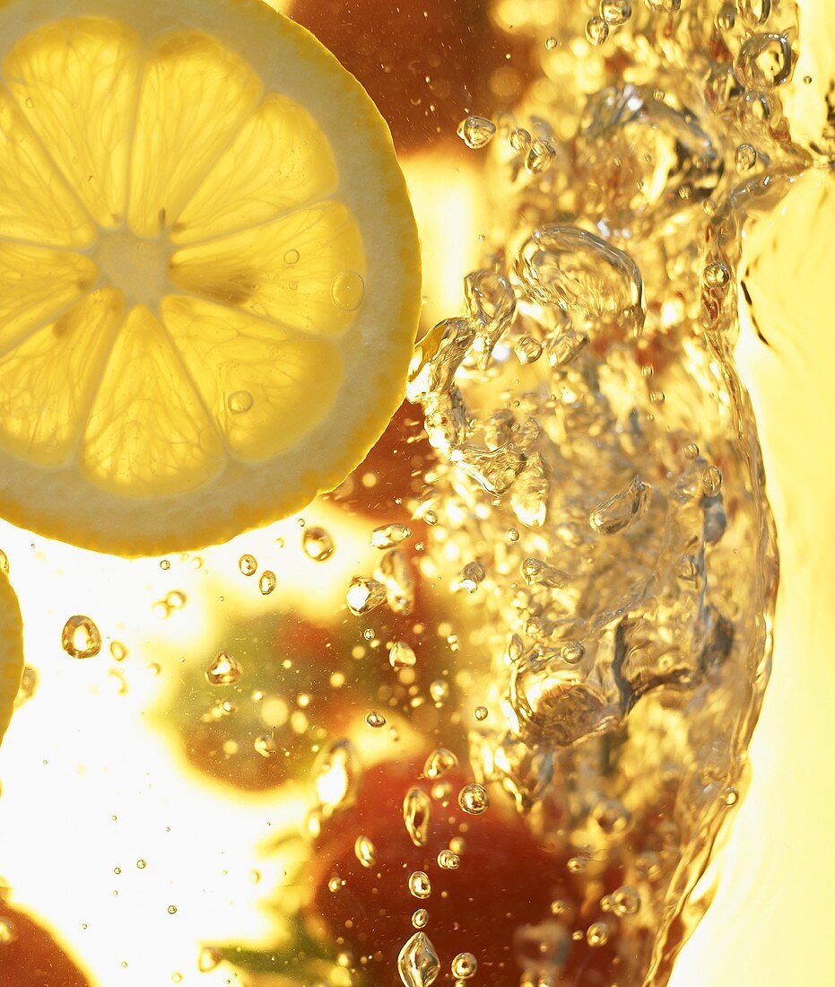 Ice-cold drink with slice of lemon (detail)