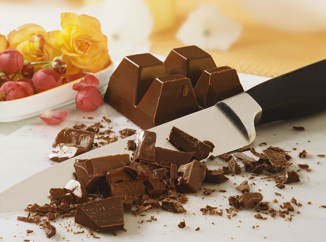 Pieces of chocolate with knife