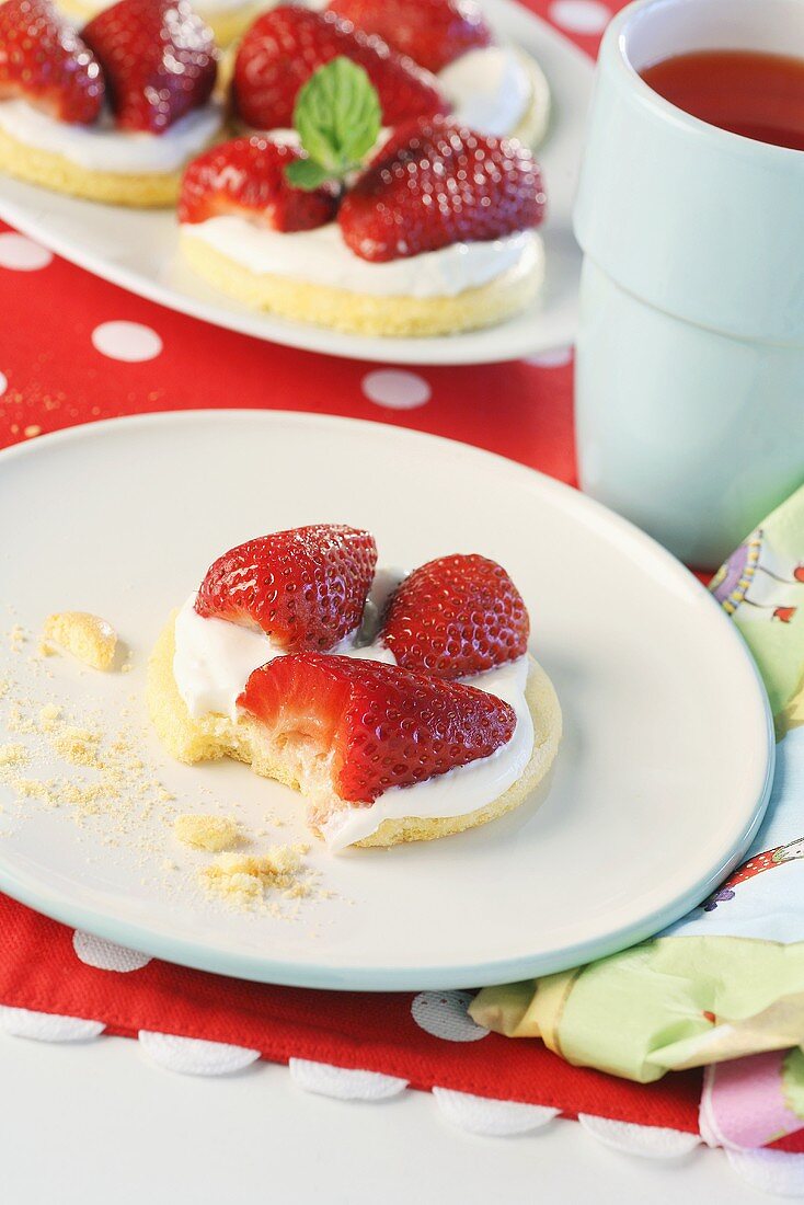 Strawberry shortcake with cream, partly eaten