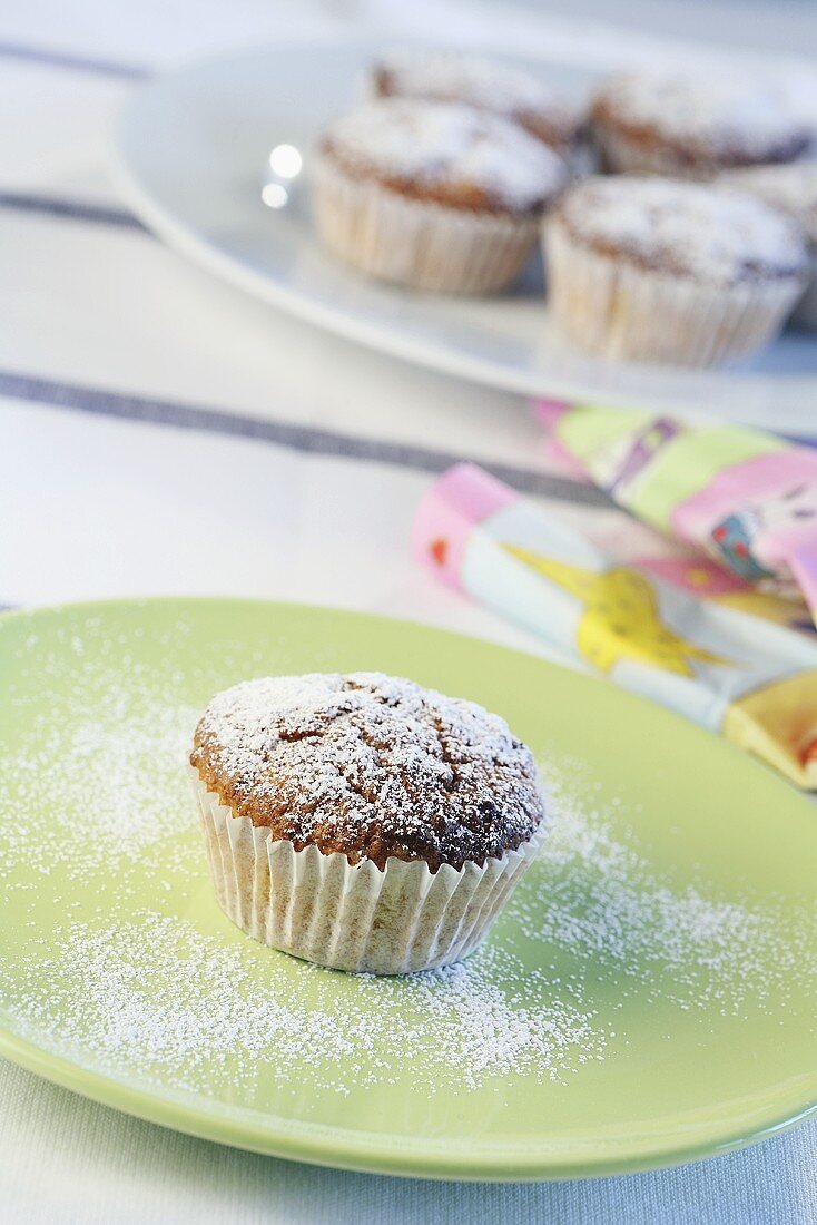 Nut muffins sprinkled with icing sugar