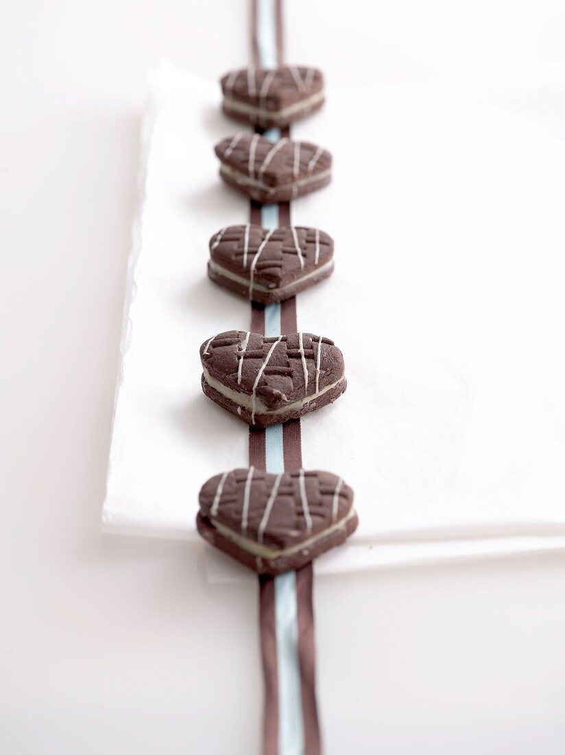 Heart-shaped chocolate sandwich biscuits filled with white chocolate cream