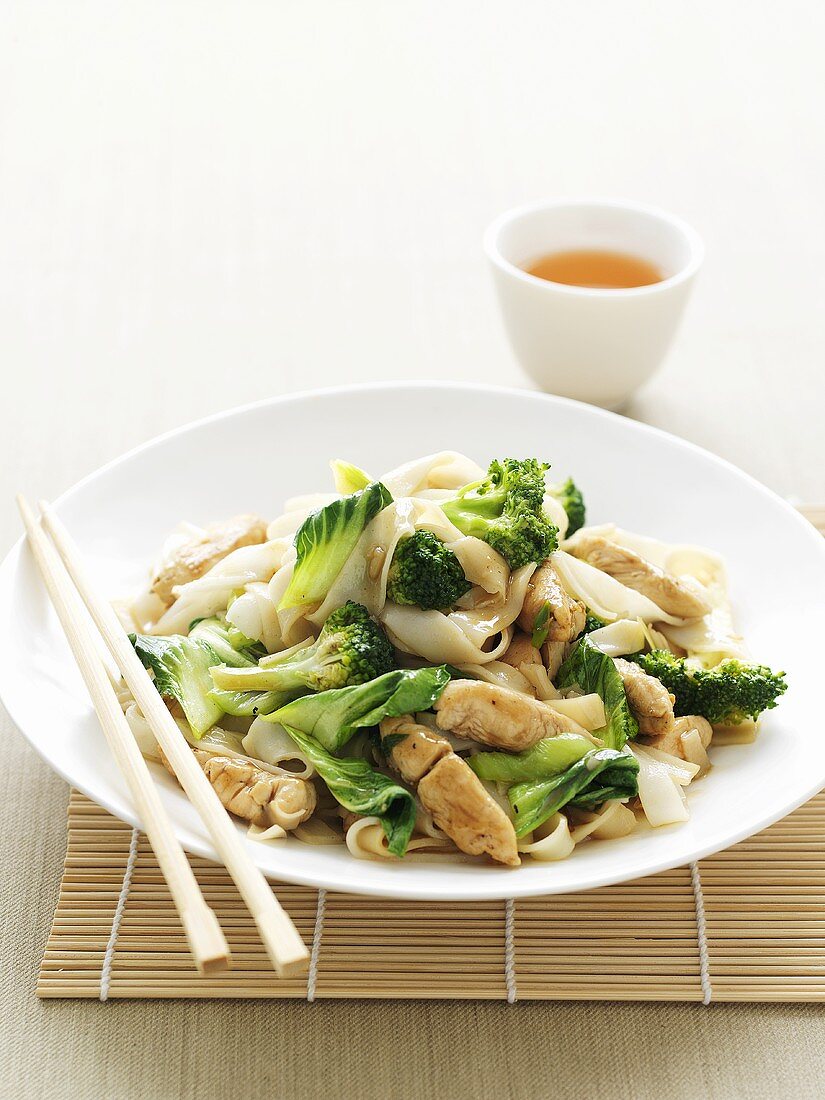 Asian noodle dish with chicken and broccoli