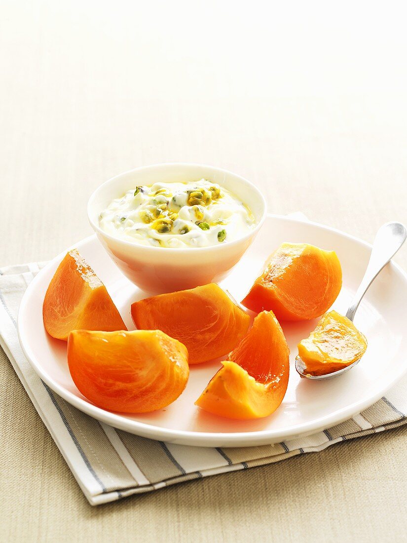 Pistachio yoghurt with passion fruit and persimmon