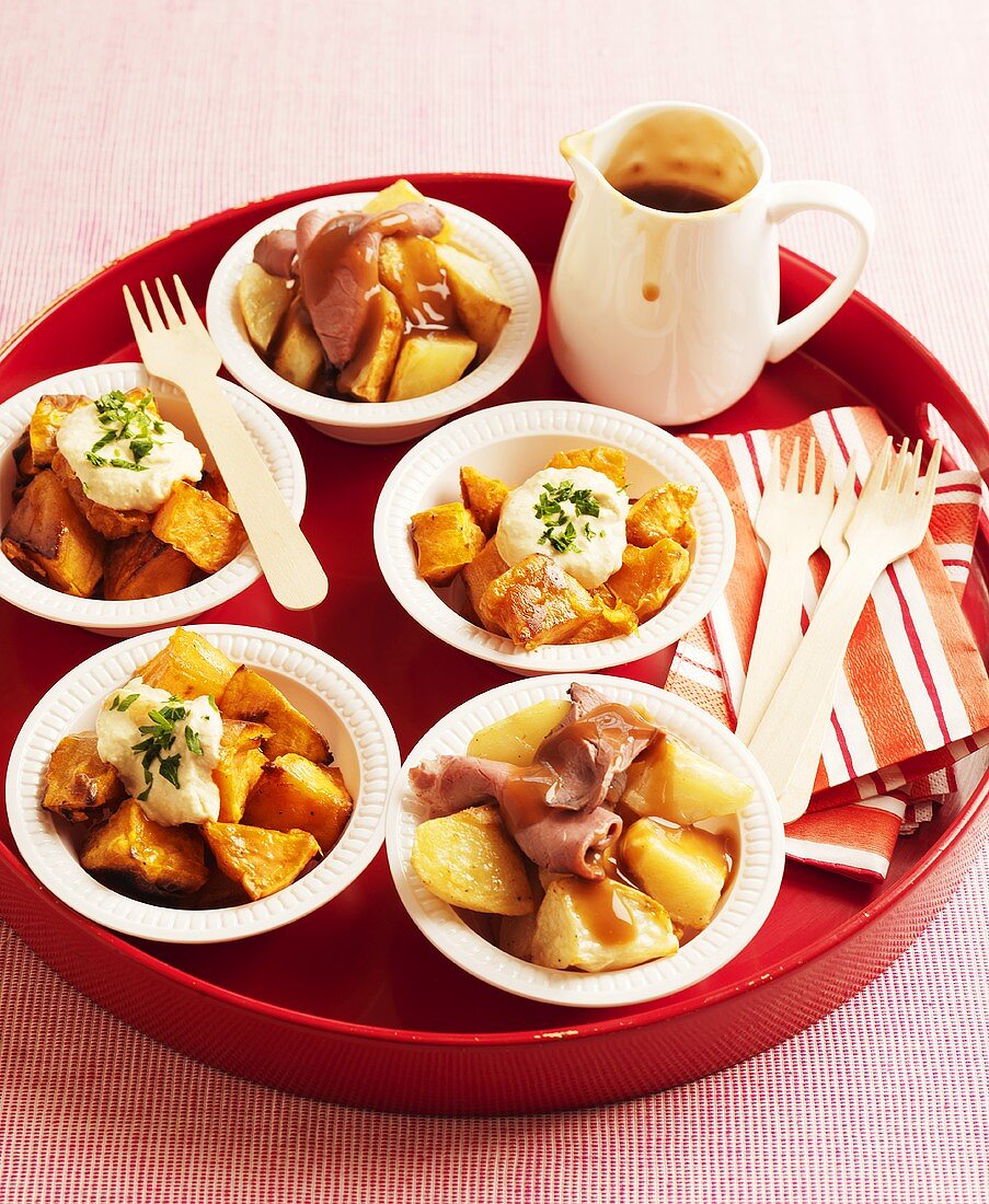 Roasted vegetables and potatoes with beef and gravy