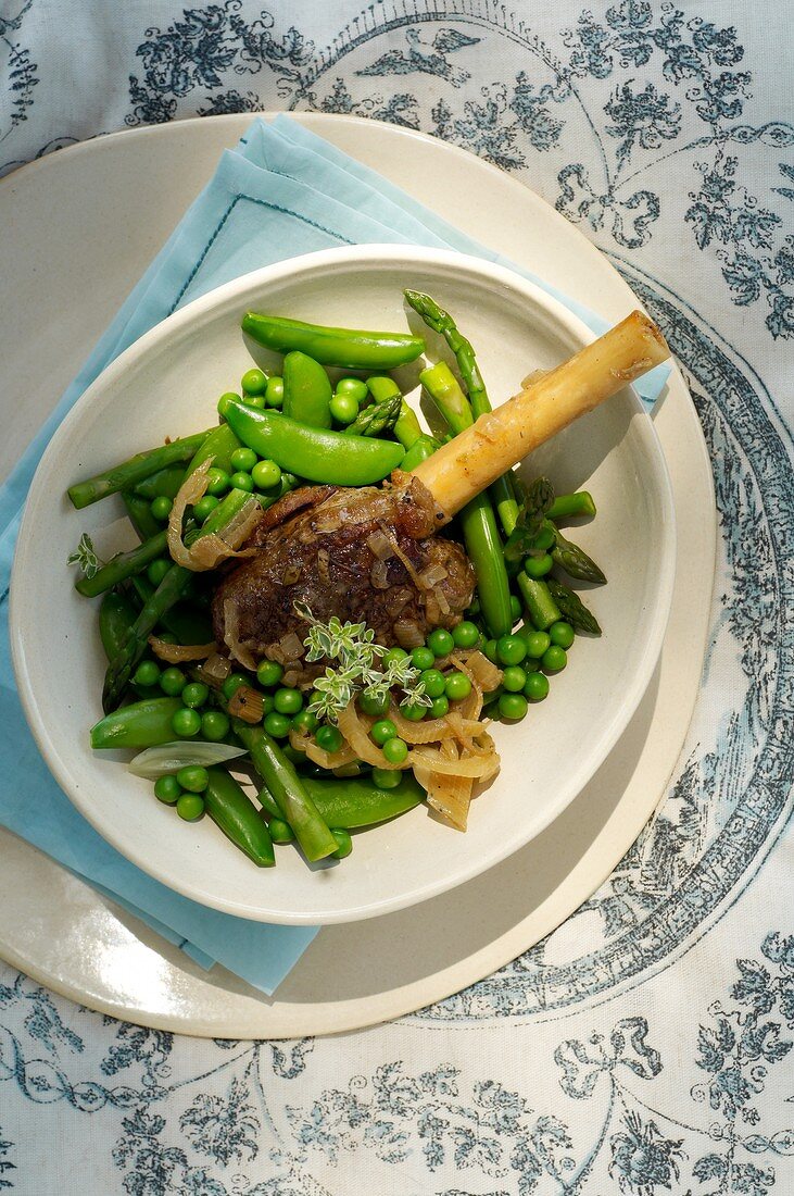 Lamb shank with vegetables and anchovies