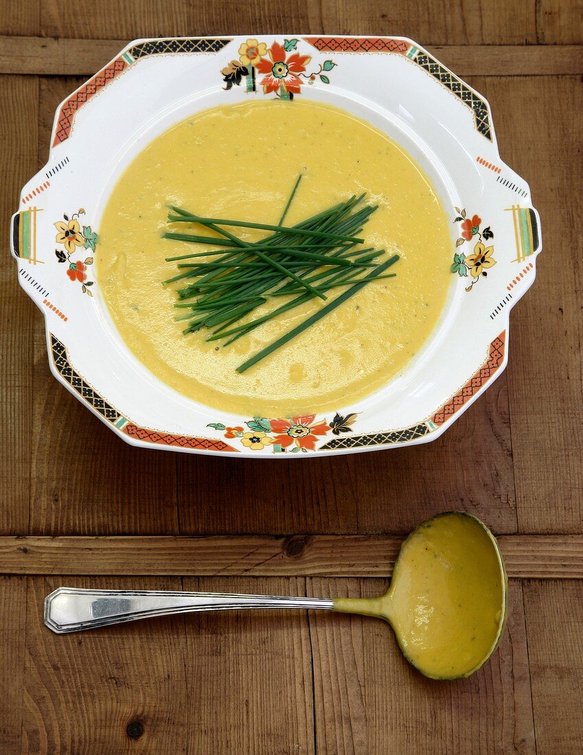 Cream of pumpkin soup garnished with chives
