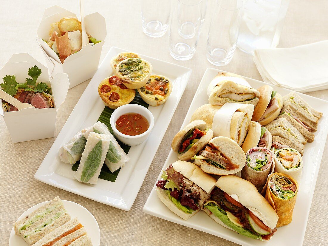 Assorted sandwiches, mini quiches and salads