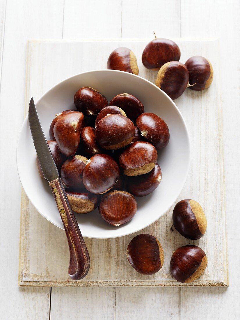 Chestnuts in and beside dish