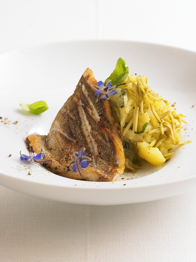 Fillet of sea bream with olive crushed potatoes