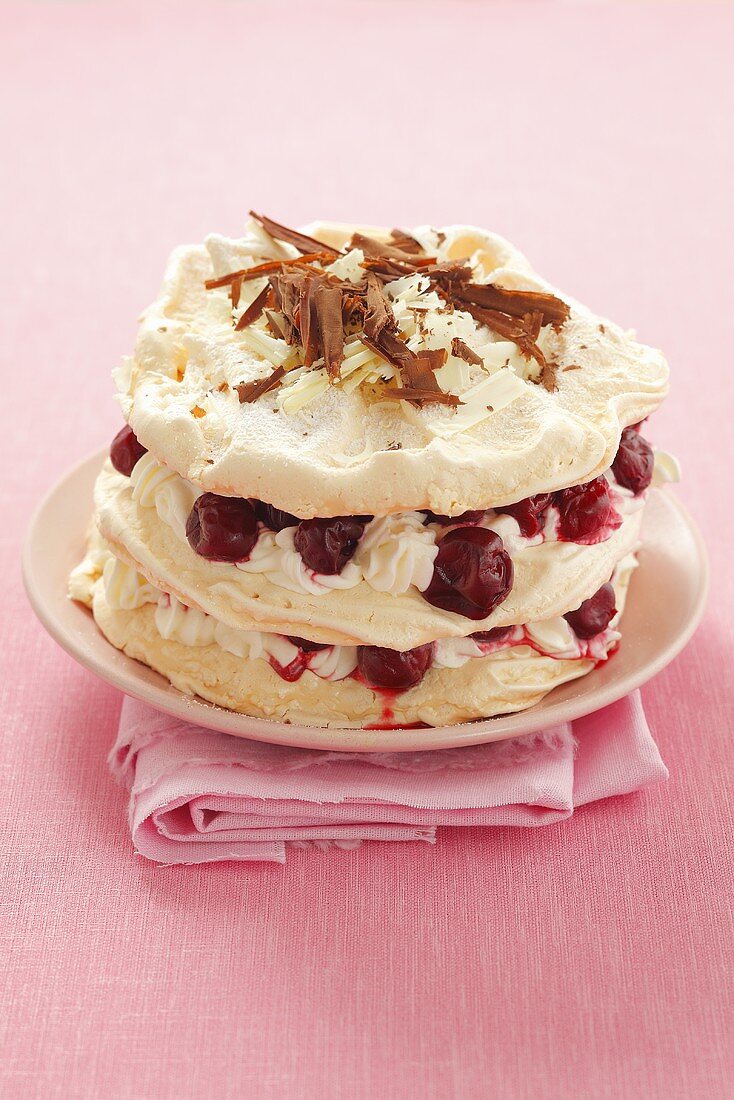 Meringue cake with cream and sour cherries