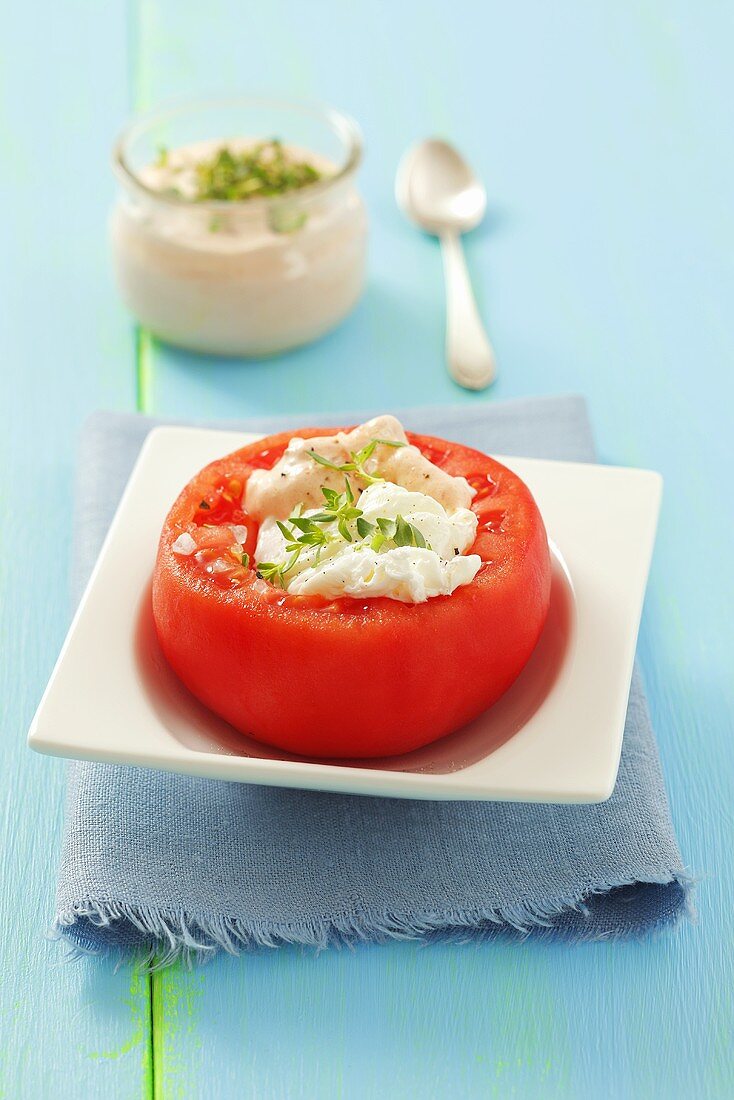 Tomato stuffed with poached egg