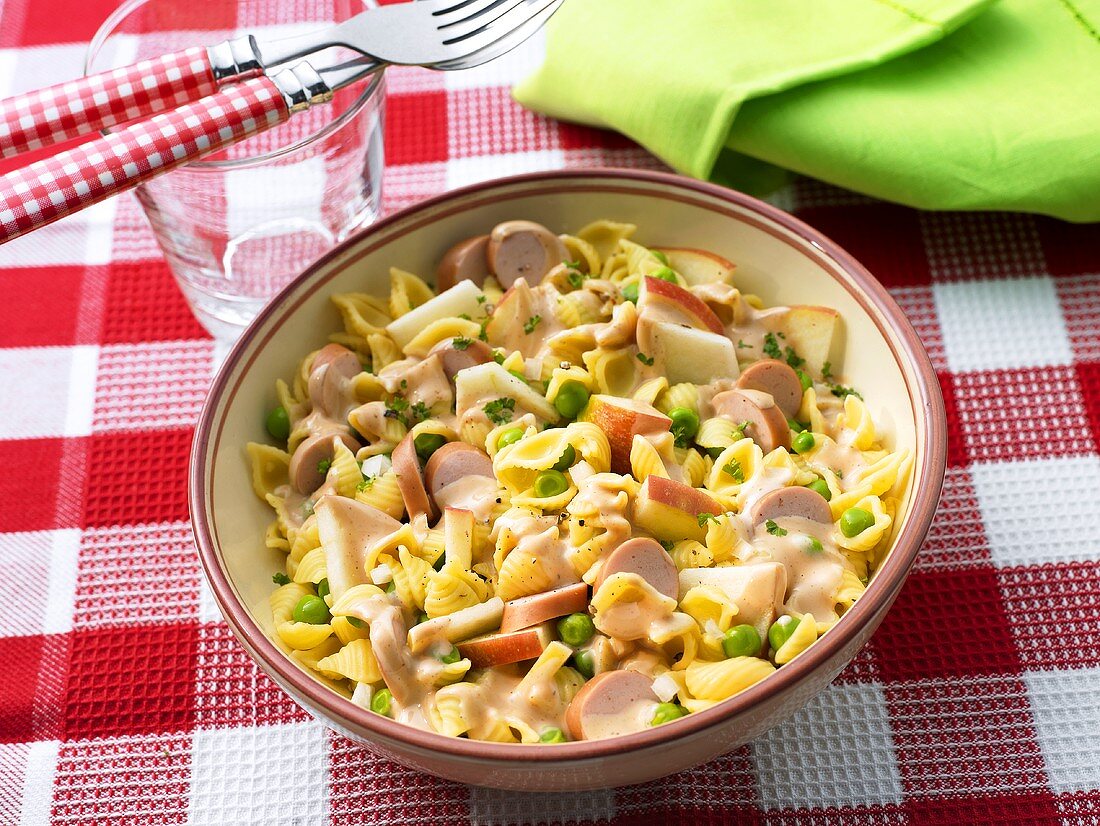 Pasta salad with sausages and peas