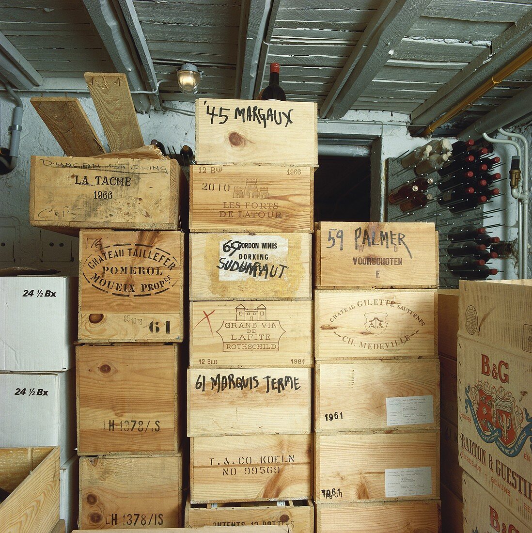 Several crates of wine in a wine cellar