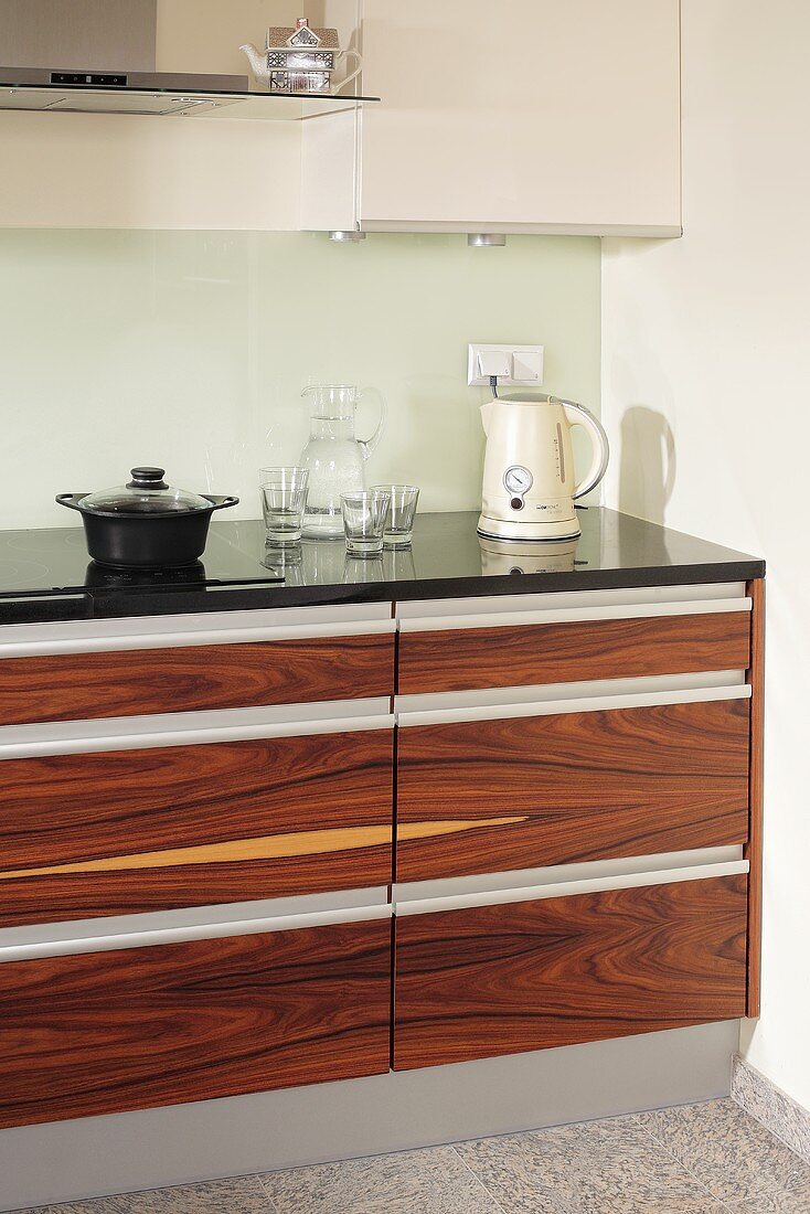 Kitchen with brown wooden drawer fronts