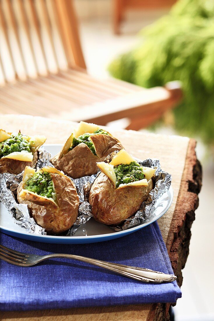 Baked potatoes with parsley sauce