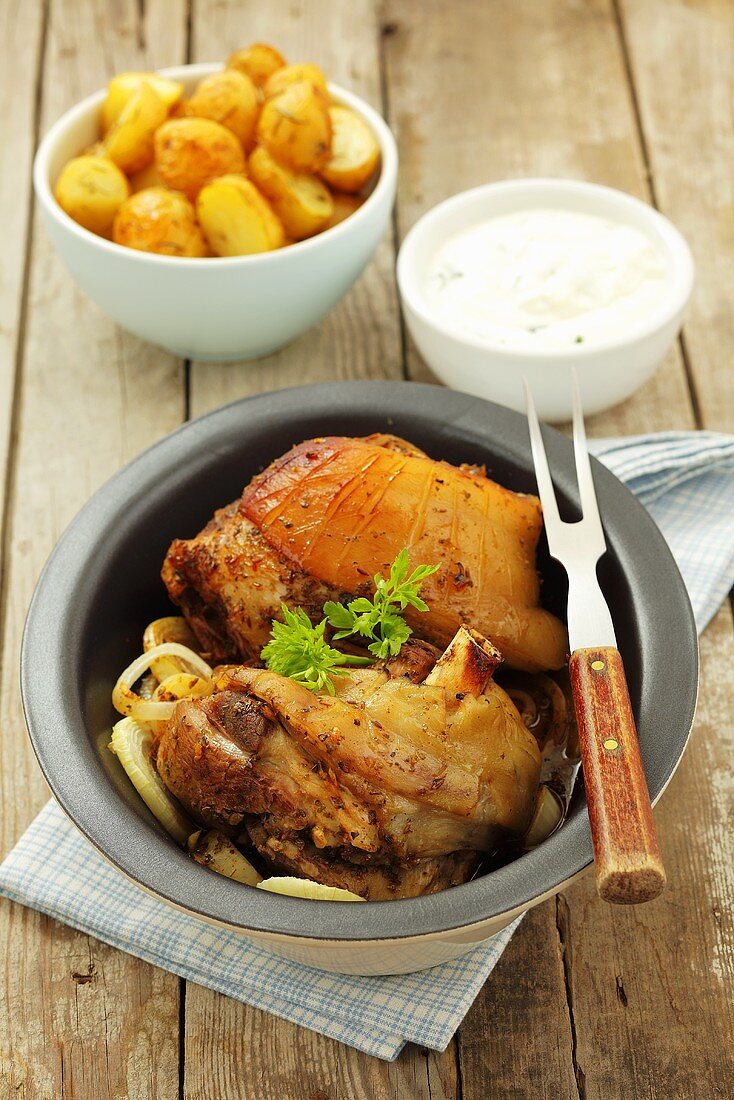 Knuckle of pork with roast potatoes and horseradish sauce