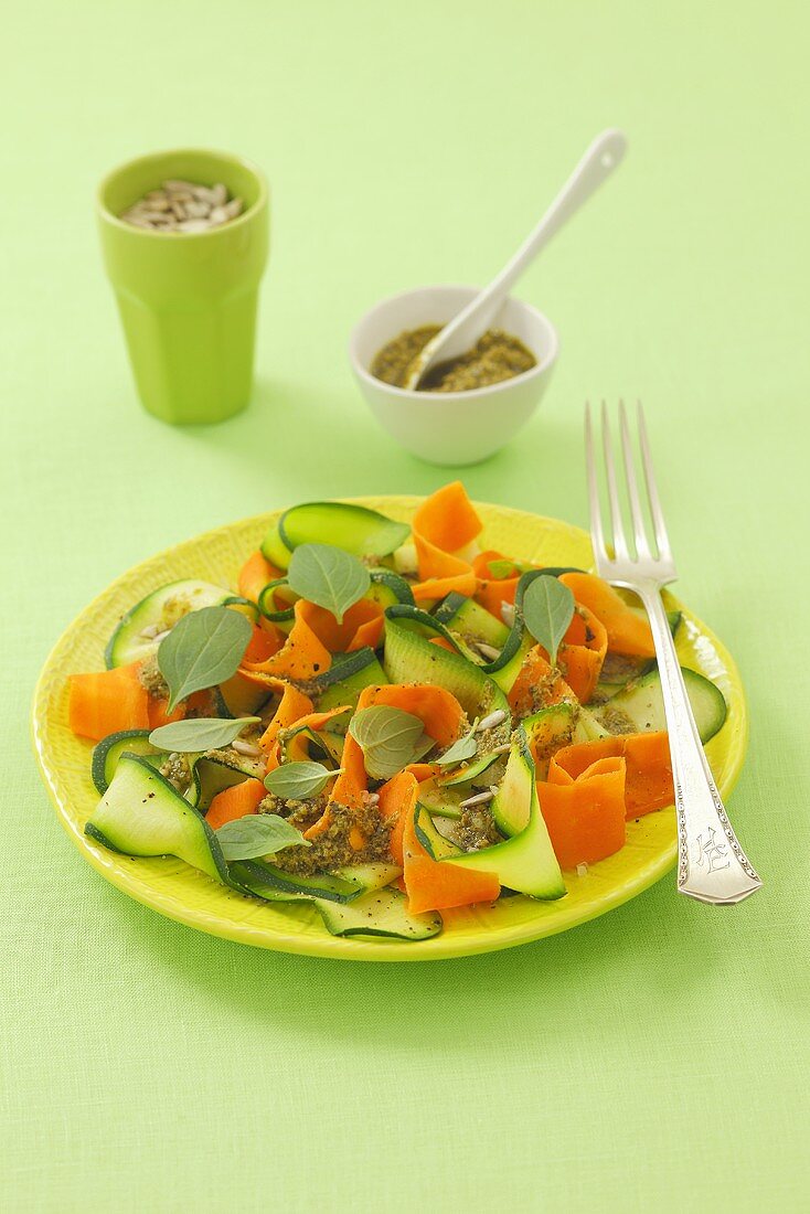 Courgette and carrot salad with pesto and sunflower seeds