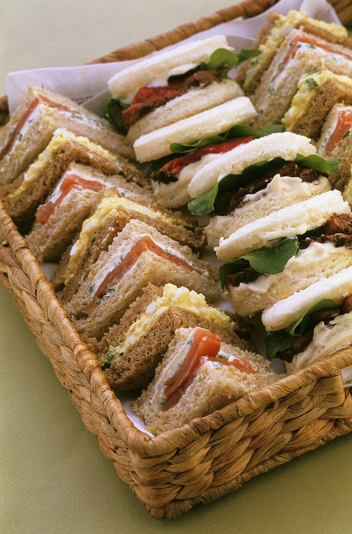 Assorted sandwiches in bread basket