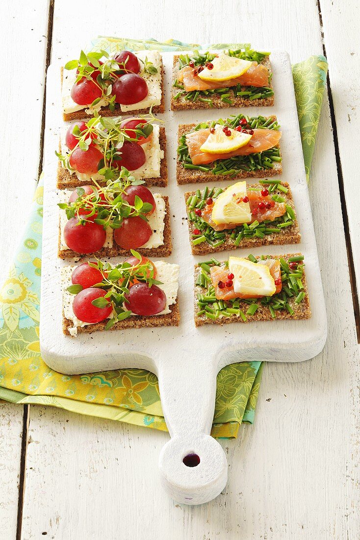 Canapes with salmon & chives and with feta & grapes