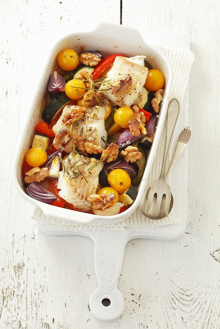 Cod with vegetables, walnuts and rosemary