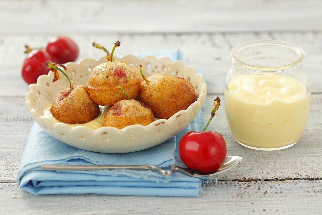 Cherry fritters with custard