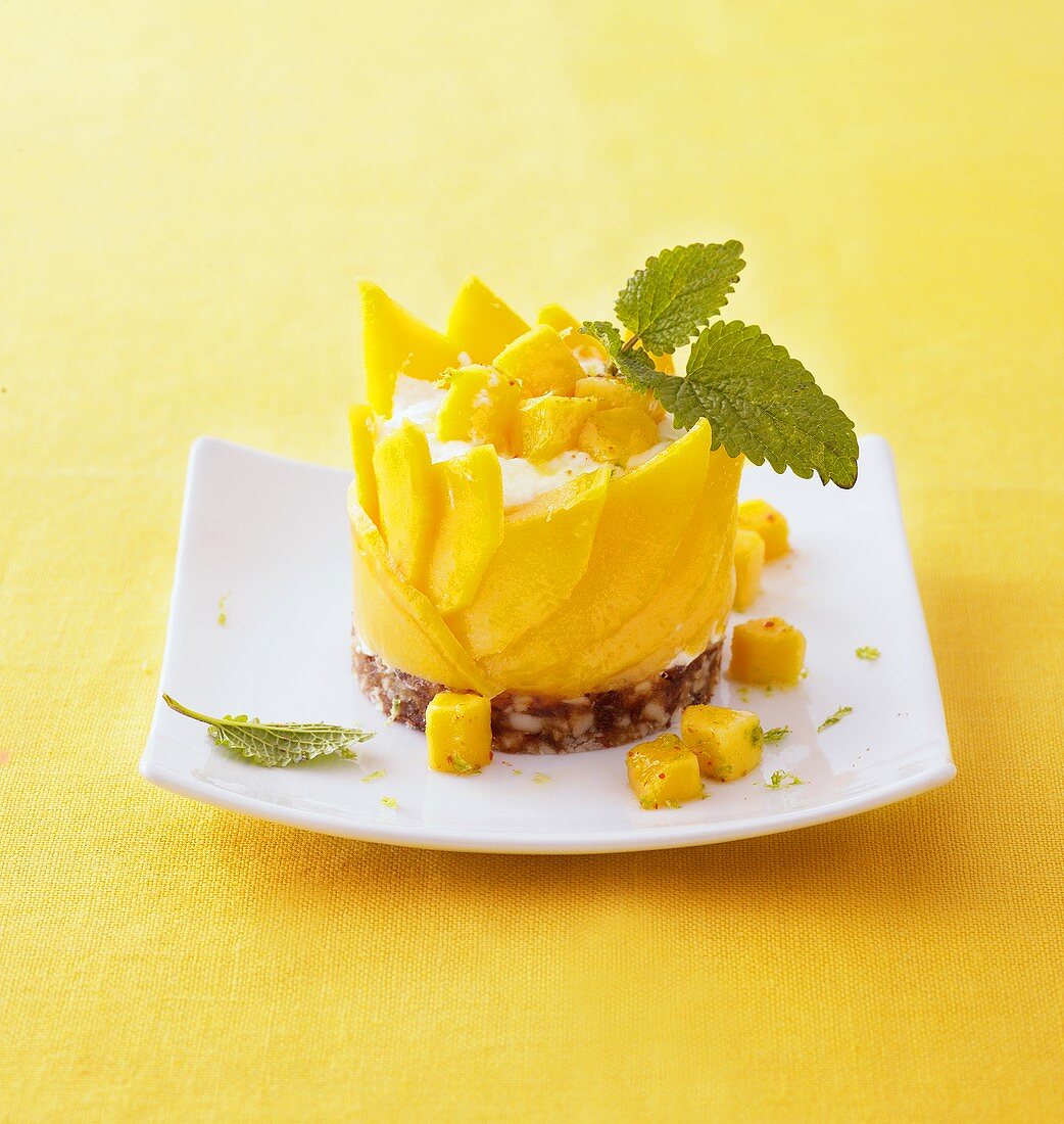 Mango and quark mousse on date and almond base