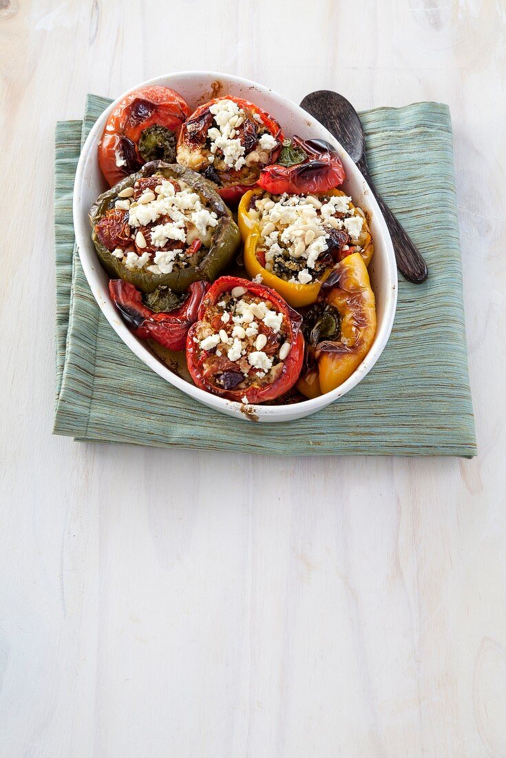 Peppers stuffed with couscous, olives and feta
