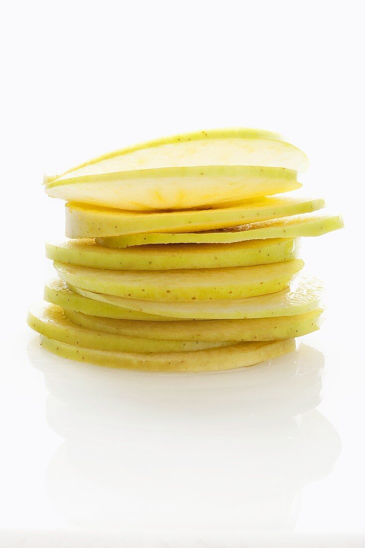 Apple slices, stacked to form an apple