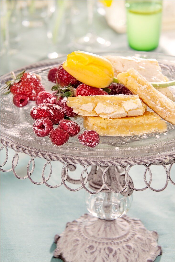 Lemon bars garnished with fresh berries