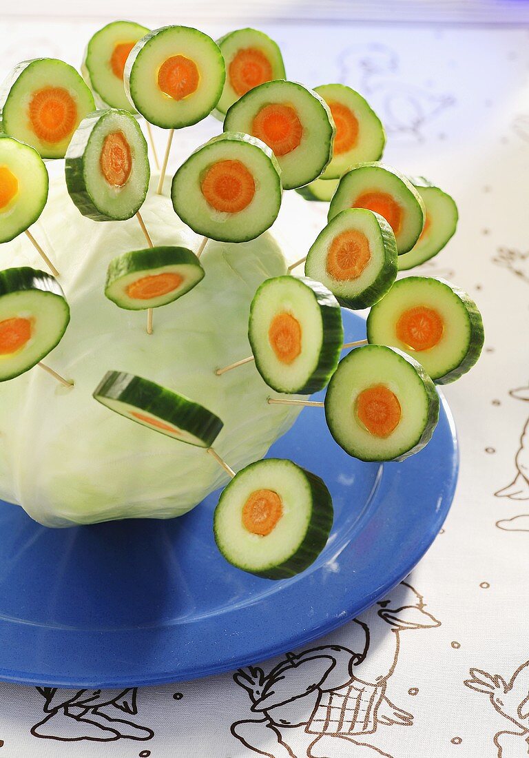 Vegetable lollipops stuck in a cabbage