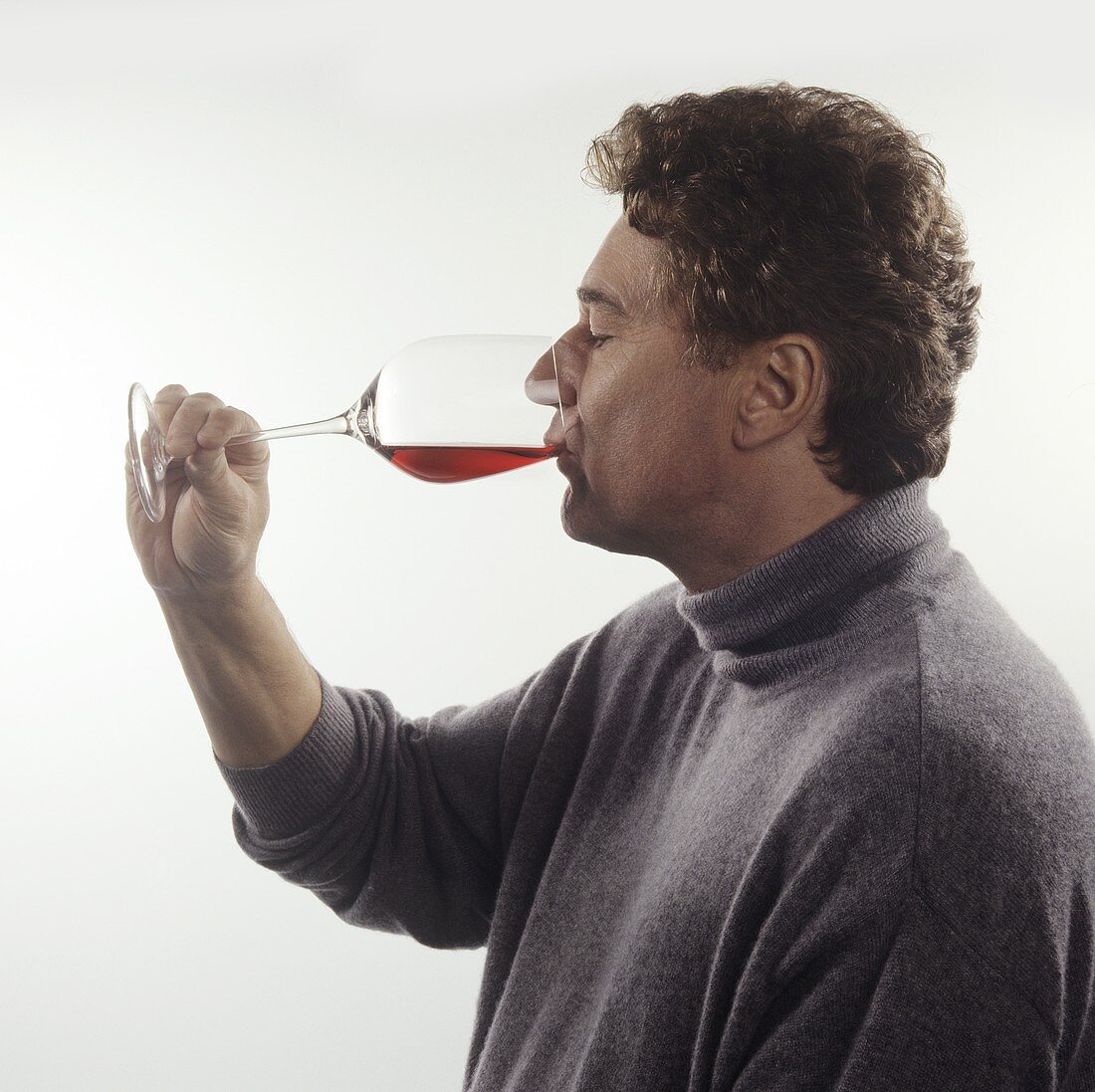 Tasting wine: taking a sip