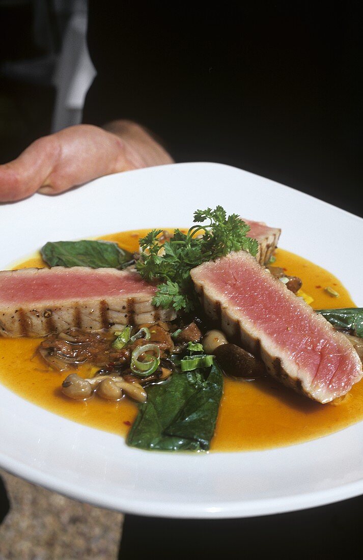 Grilled tuna in ginger Chardonnay sauce with mushrooms