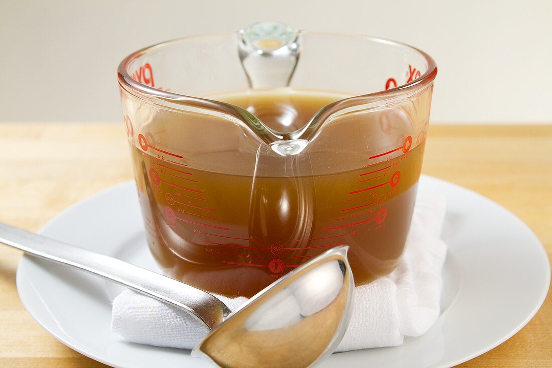 Lobster stock in a measuring jug