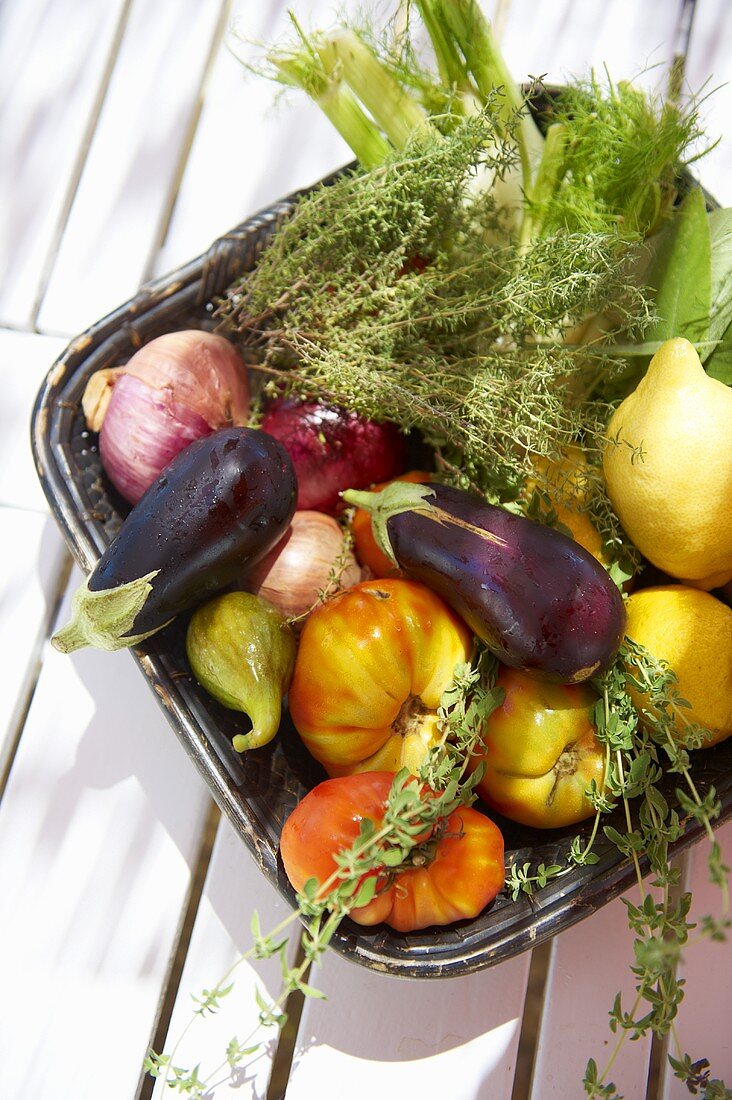 Mediterranean veetables, lemons and thyme in a bowl