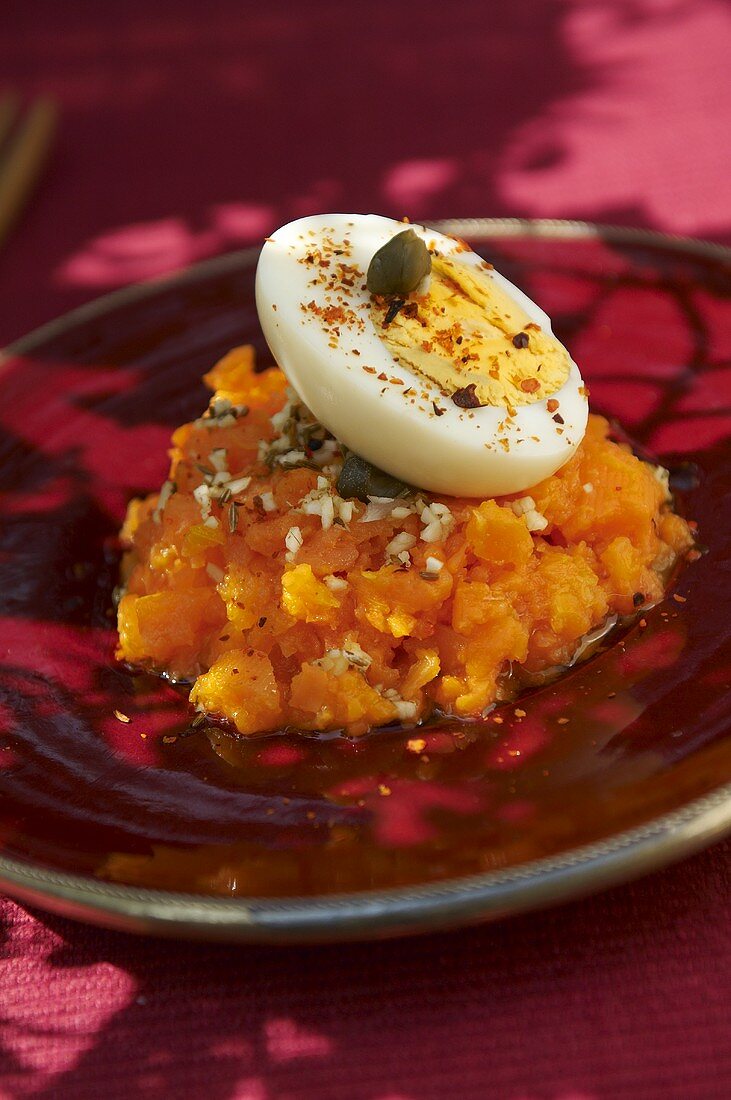 Carrot puree with boiled egg and capers