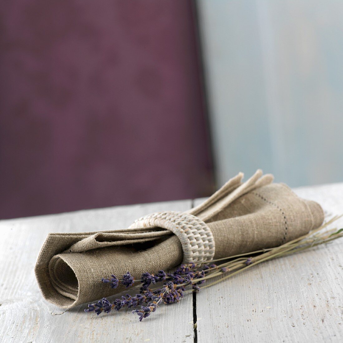 A napkin with a napkin ring and lavender flowers from Provence
