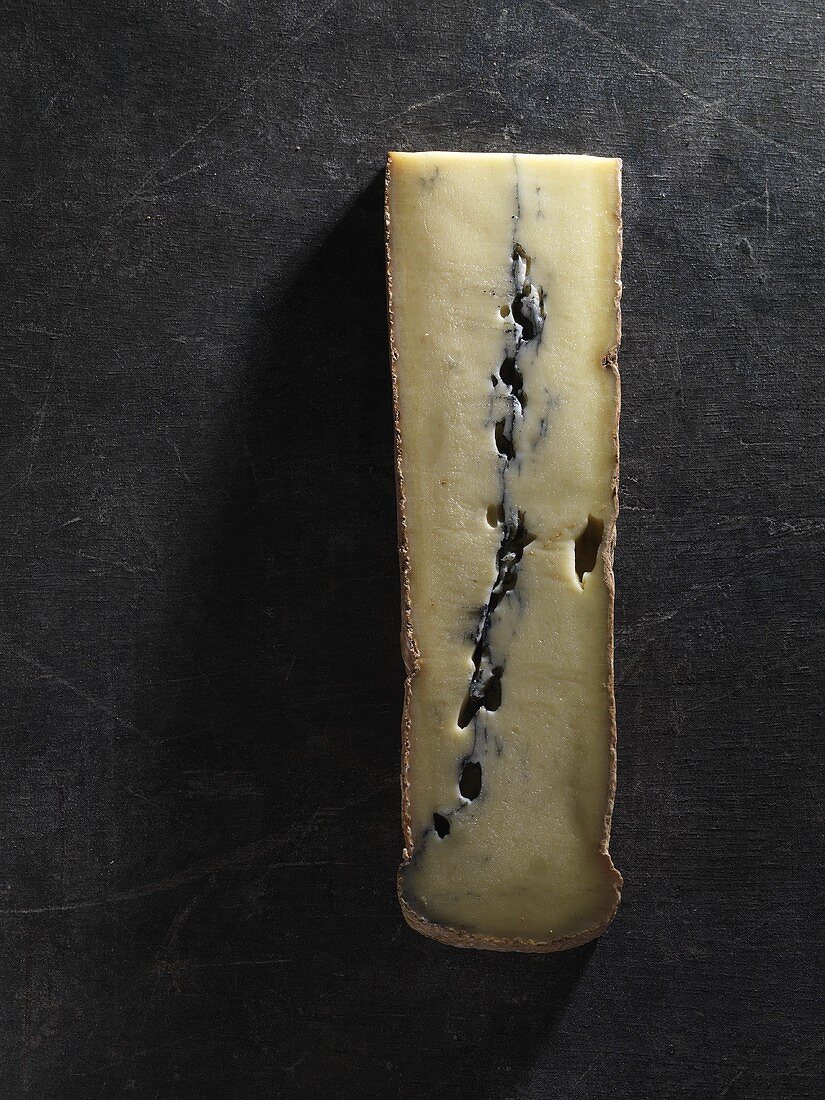 A piece of Morbier vieux cheese