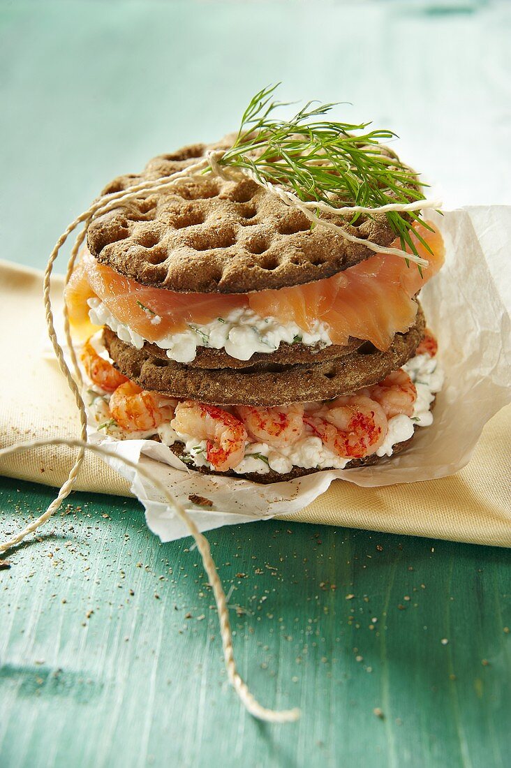 A cray fish, smoked salmon and cottage cheese sandwich on crisp bread