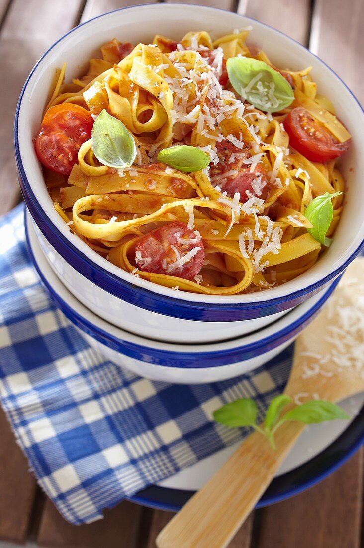 Tagliatelle with cherry tomatoes, basil and grated cheese