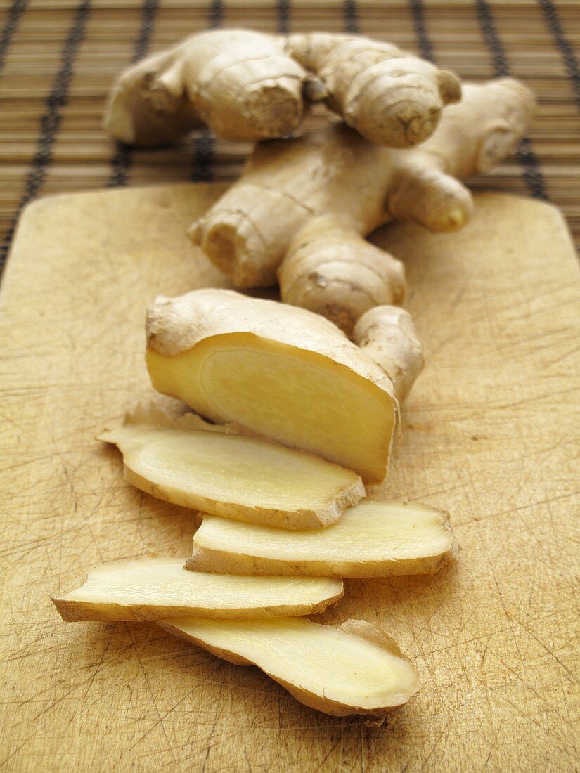 Fresh ginger, whole and sliced