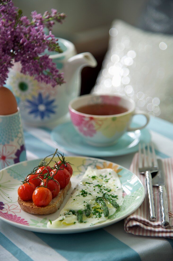 An egg white omelette with green asparagus and tomato bread