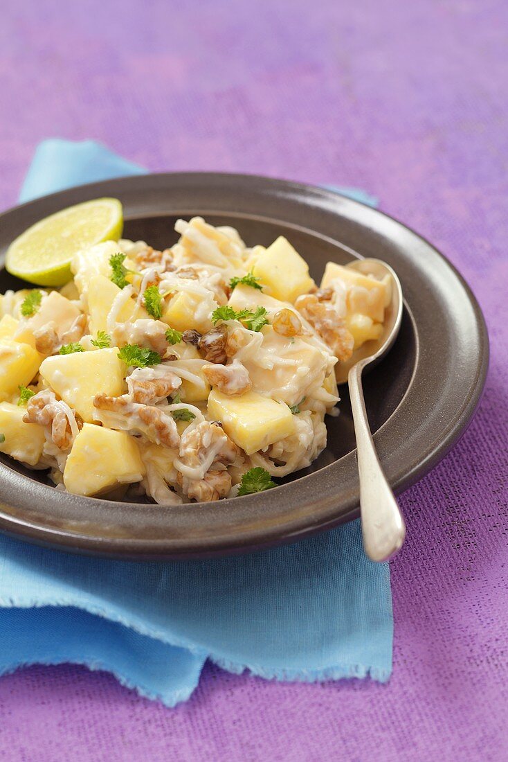 Celery and pineapple salad with walnuts and raisins